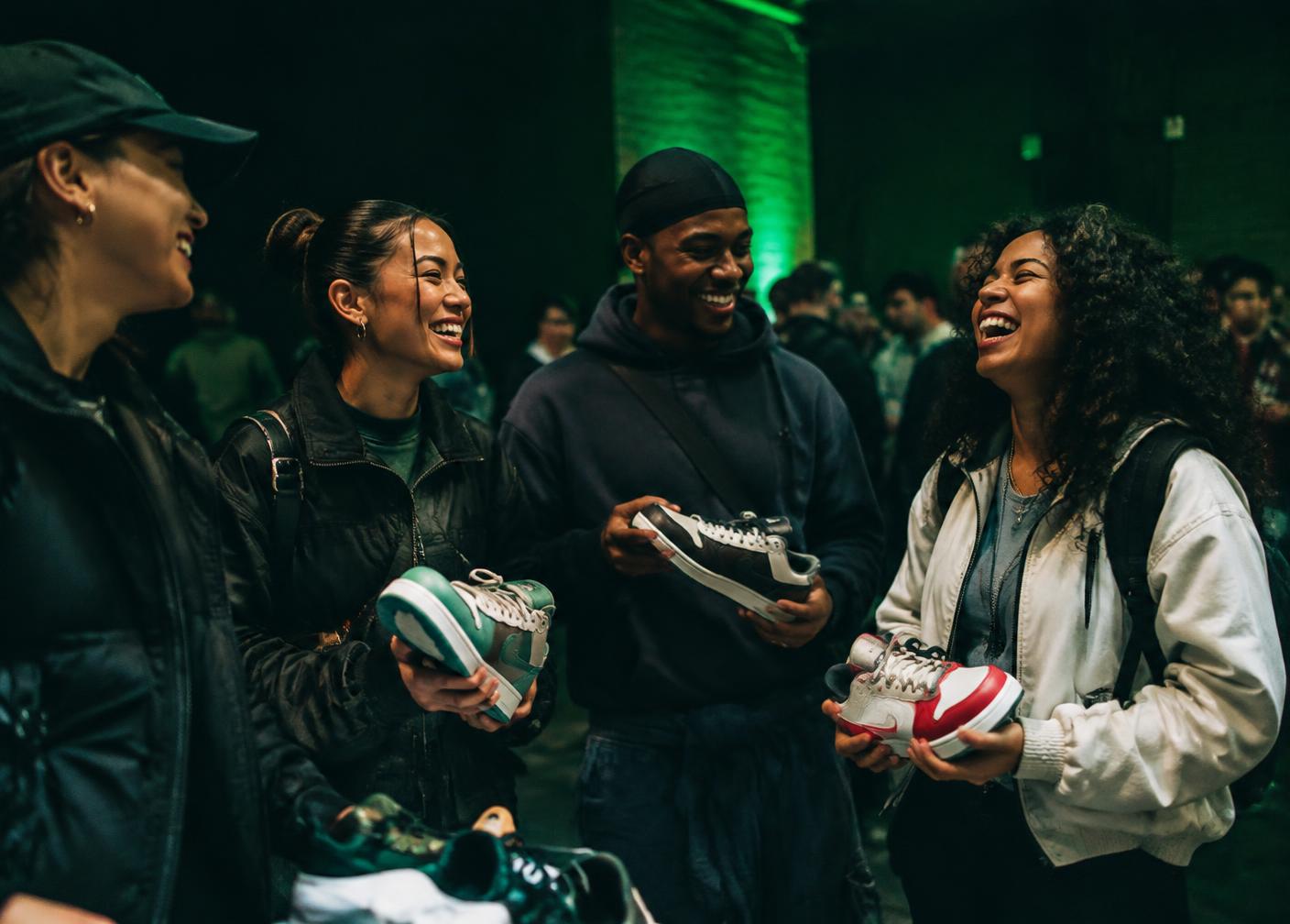 Friends sharing sneakers at a Creps & Culture style event